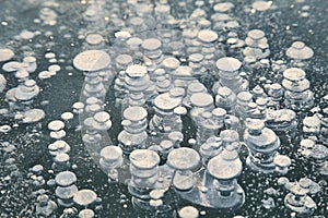 Winter ice with gas bubbles trapped inside