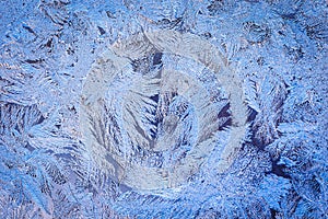 Winter ice pattern on the frozen window.