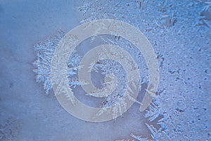 Winter ice pattern on the frozen window.