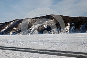Winter ice road on the Stood sea photo