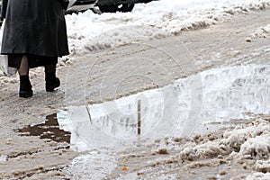 Winter. Ice on roads. Heavy snowfall in the city, snowy icy roads, snowy sidewalks, broken broken branches, uncleaned streets