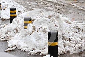 Winter. Ice. Snow. People walks a snowy icy road passing snowy cars on uncleaned icy street after a heavy snowfall. Unclea