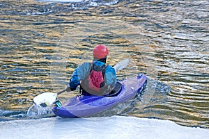 Winter Kayaker in Purple Kayak