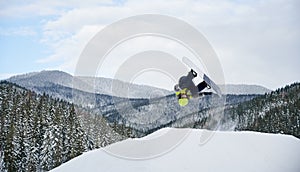 Winter kinds of sport. Skier doing tricks in the mountains in winter season