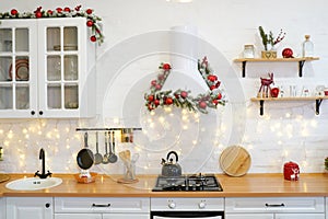 Winter kitchen with red decorations, christmas cooking table and utensils