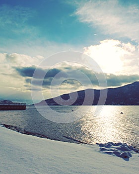 Winter lake and bright cloud