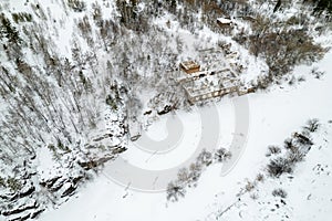 winter landscape of an abandoned building covered with snow