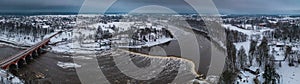 Winter landscape. Aerial view of Venta river in Kuldiga, Latvia. Widest waterfall in Europe - Venta rapid