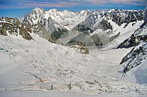 Winter landscape in Alps Mountains. Sun and snow in Valley Blanche, landmark attraction in France