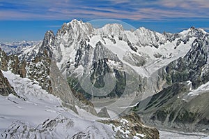 Winter landscape in Alps Mountains. Sun and snow in Valley Blanche, landmark attraction in France