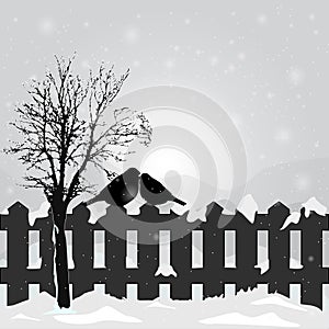 Winter landscape with bird bullfinch on fence, snow covered hills and snowy tree.