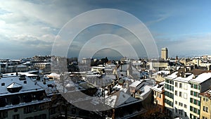 Winter landscape of City of Lausanne, Vaud Canton, Switzerland. Houses using Energy for Heating. Bel-air tower.