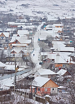 winter landscape with country houses covered with snow