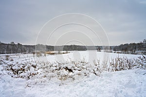 A winter landscape covered in snow on a crispy cold winter day. Picture from Scania, Sweden