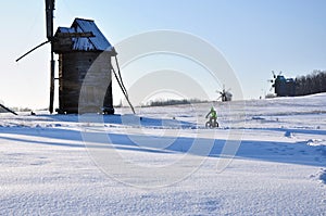 Winter landscape, cyclist