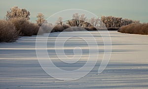 Winter landscape, dawn over the river