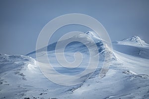 Winter landscape with dramatic snowy mountains