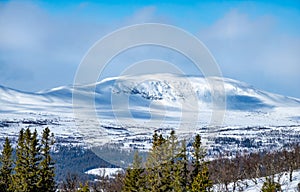 Winter landscape with dramatic snowy mountains