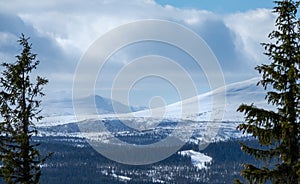 Winter landscape with dramatic snowy mountains