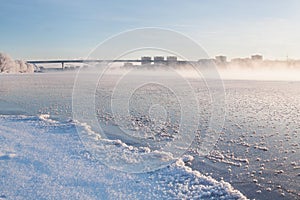 Winter landscape in the early morning overlooking the city of Dubna and the bridge over the Volga.