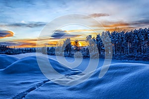 The winter landscape. Evening twilight. In a deep snowdrift a path is trodden.