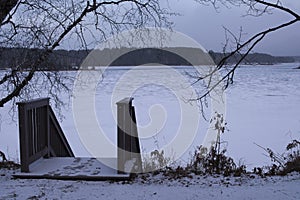 Winter landscape with frozen lake