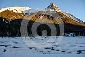 Winter landscape of the frozen Lake Medicine surrounded by the Canadian Rockies in Jasper National Park, Alberta, Canada