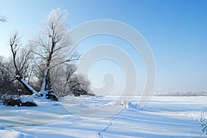 Winter landscape with frozen river