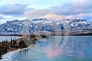 Winter landscape of the frozen Talbot Lake in Jasper National Pa photo