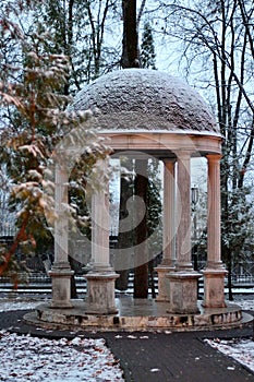 winter landscape with a gazebo in the snow in a city park russia