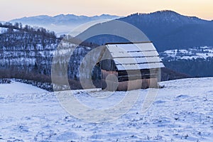 Winter landscape with hayloft in Velka Fatra, Slovakia