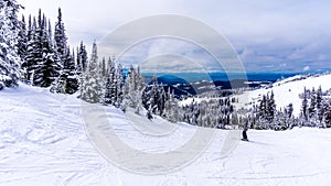 Winter Landscape in the High Alpine with Snow Covered Trees on the Hills surrounding Sun Peaks