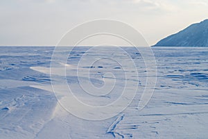 Winter landscape of lake and mountains