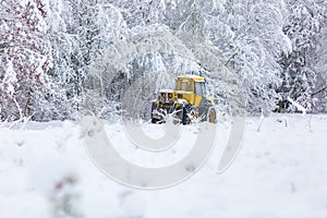 Winter landscape with machine (snow plow at work)