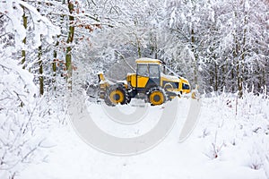 Winter landscape with machine (snow plow at work)