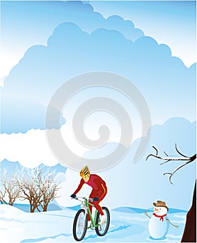 Winter landscape with a mountain biker.