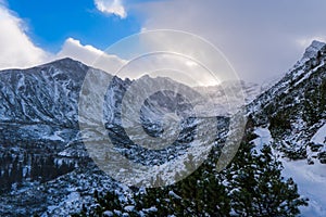 Winter landscape in the mountains in cloud day . The path in the snow. Tatry mountain, Poland , Europe