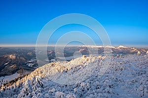 Winter landscape in mountains illuminated at sunrise, slovakia Velky Choc