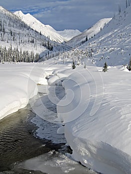 Winter landscape with mountains, river and trees, Purcell Mountains, Bugaboo Provincial Park, Britisch Columbia