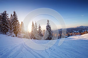 Winter landscape in mountains at sunset