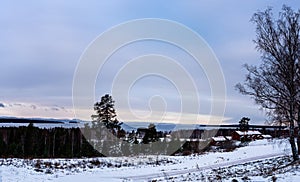 View of winter landscape during sunset from the village of TÃÂ¤llberg, Dalarna, Sweden photo