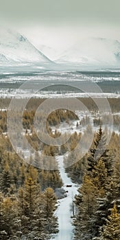 Winter Landscape With Mountains And Trees On Either Side Of A Road