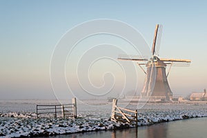 Winter landscape in the Netherlands with a windmill