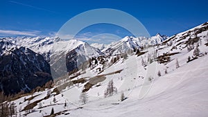 Winter landscape - Panorama of the ski resort with ski slopes and ski lifts. Alps. Austria. Karnten