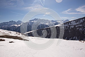 Winter landscape - Panorama of the ski resort with ski slopes and ski lifts with blue sky on background. Alps. Austria