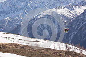 Winter landscape - Panorama of the ski resort with ski slopes and ski lifts with mountains on background. Alps. Austria