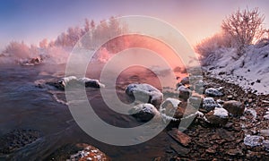 Winter Landscape In Pink Tones: Frosty Morning, River Blurred Water,Stones In Frazil And Sun In Fog.Belarus Landscape With Snowy T