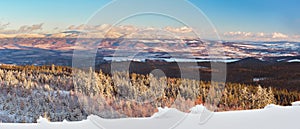 Winter landscape in the Polish mountains of the Sudetes, a view of the Snieznik Massif from the top of the mountain