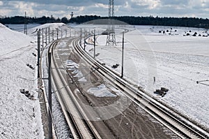 A winter landscape with railway tracks under construction