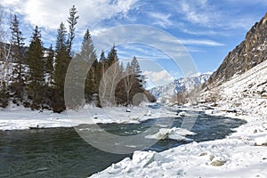 Winter landscape. River in Altai on  sunny day. Russia